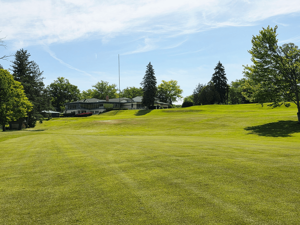 View of the Black River Country Club clubhouse taken from the course.